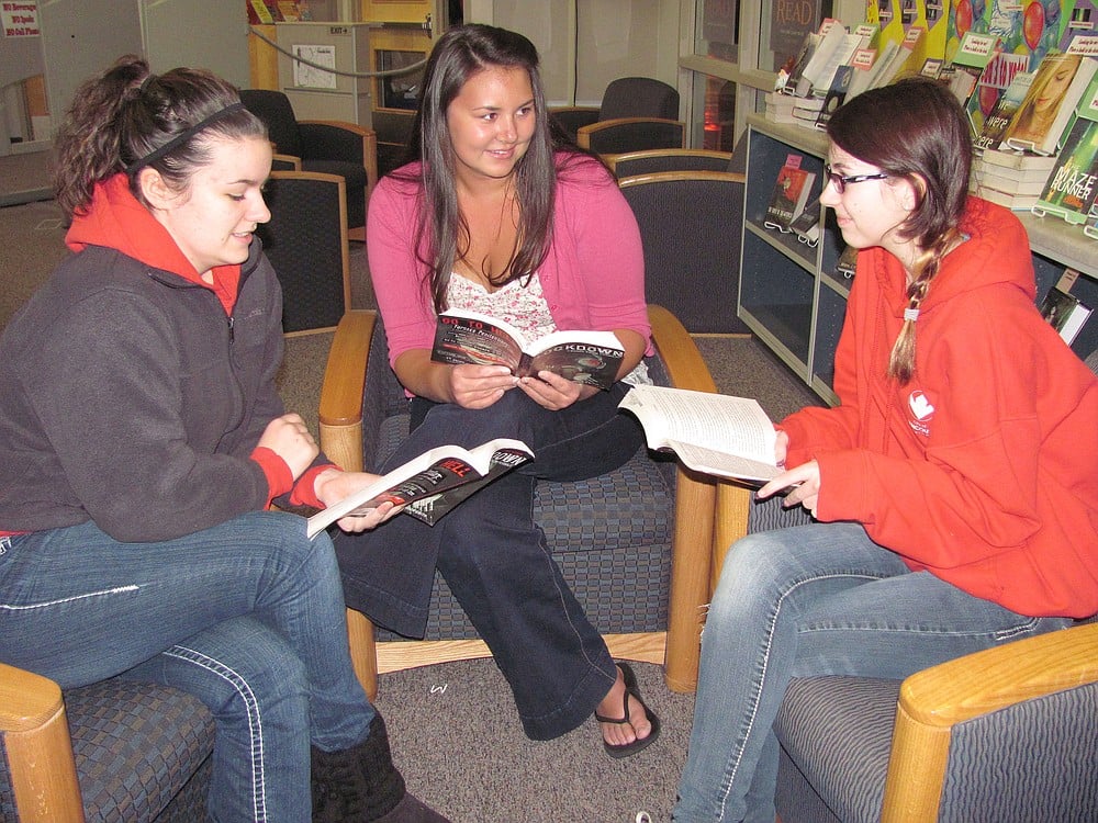 Camas High School students (from left) Ashley Mayfield, Cassidy Hines and Elizabeth Walsh are a part of the Papermaker Book Club. They enjoy the opportunity to discuss different books with other teens who share a love of reading.