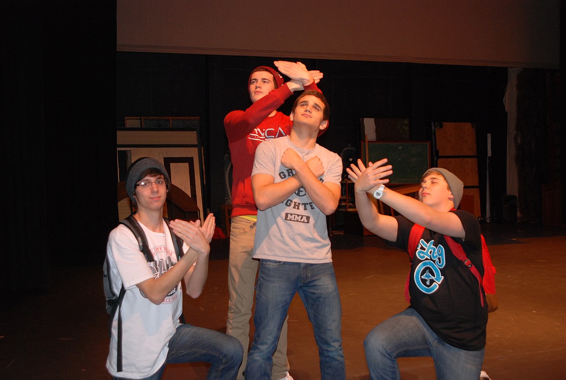 Washougal High School ASL students ham it up as they rehearse their rendition of the love song, "Some Say Love."  Pictured above, from left to right, are Austin Smith-Brown, Spencer Adams and Scott Nelson. Tanner Baldwin is in the center.