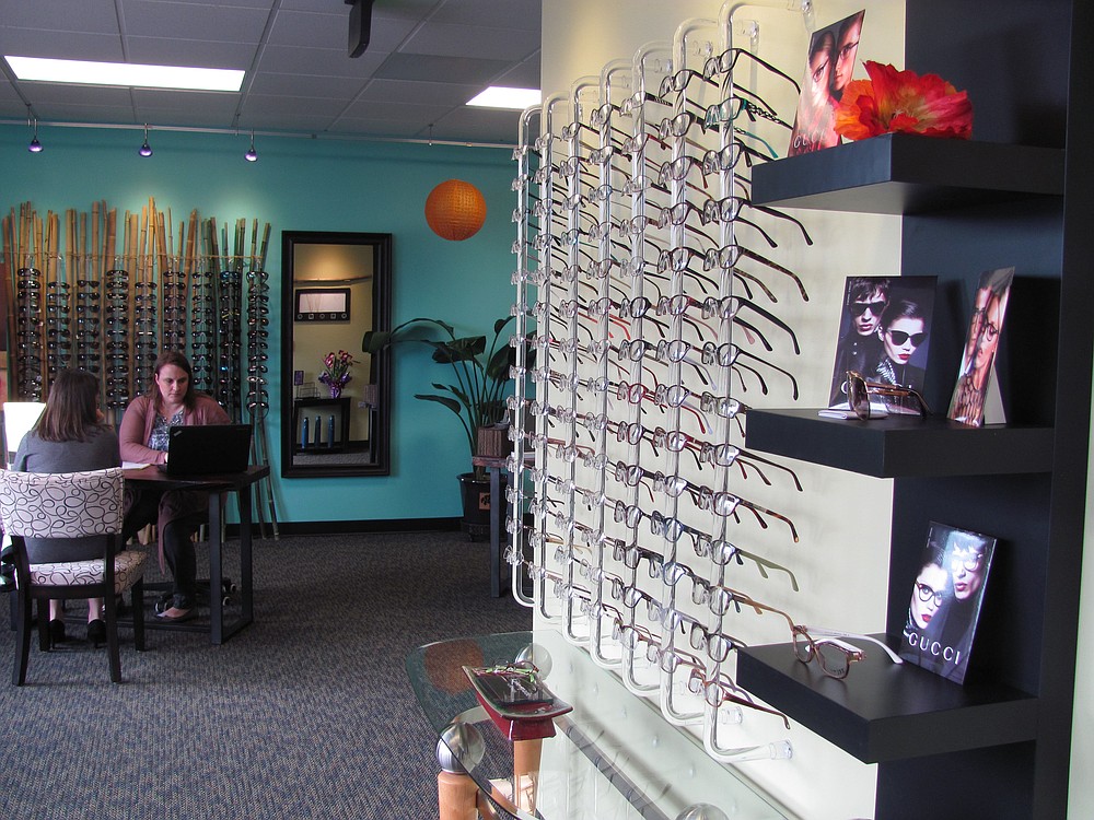 Julie Post, an optician at Vancouver Vision Clinic, assists a patient with the process of ordering glasses. The clinic recently relocated within downtown Camas. "We outgrew our other space," Post said. The remodeled location features three exam rooms and a larger optical department.