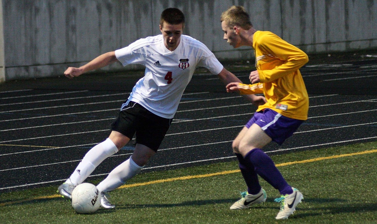 Camas forward Cayne Cardwell keeps the soccer ball alive for the Papermakers in the far right corner at Doc Harris Stadium. Camas defeated Columbia River 2-0 Wednesday.