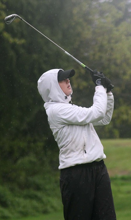 With blurry vision created by relentless rain drops, Molly Bilsborough lands her tee shot on the 17th green of the Lewis River golf course Thursday. The CHS senior won the Chieftain Invitational's closest to the pin challenge on this hole.