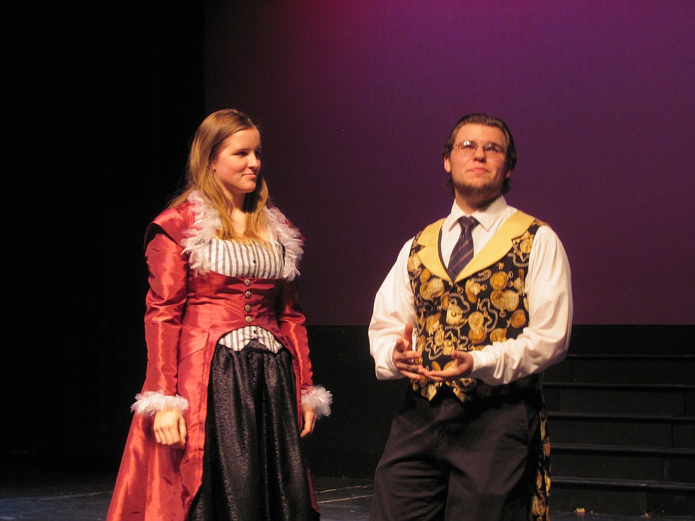 Theatre managers (Jacob Lively and Keira Stogin) discuss the strange turn of affairs their show has taken.