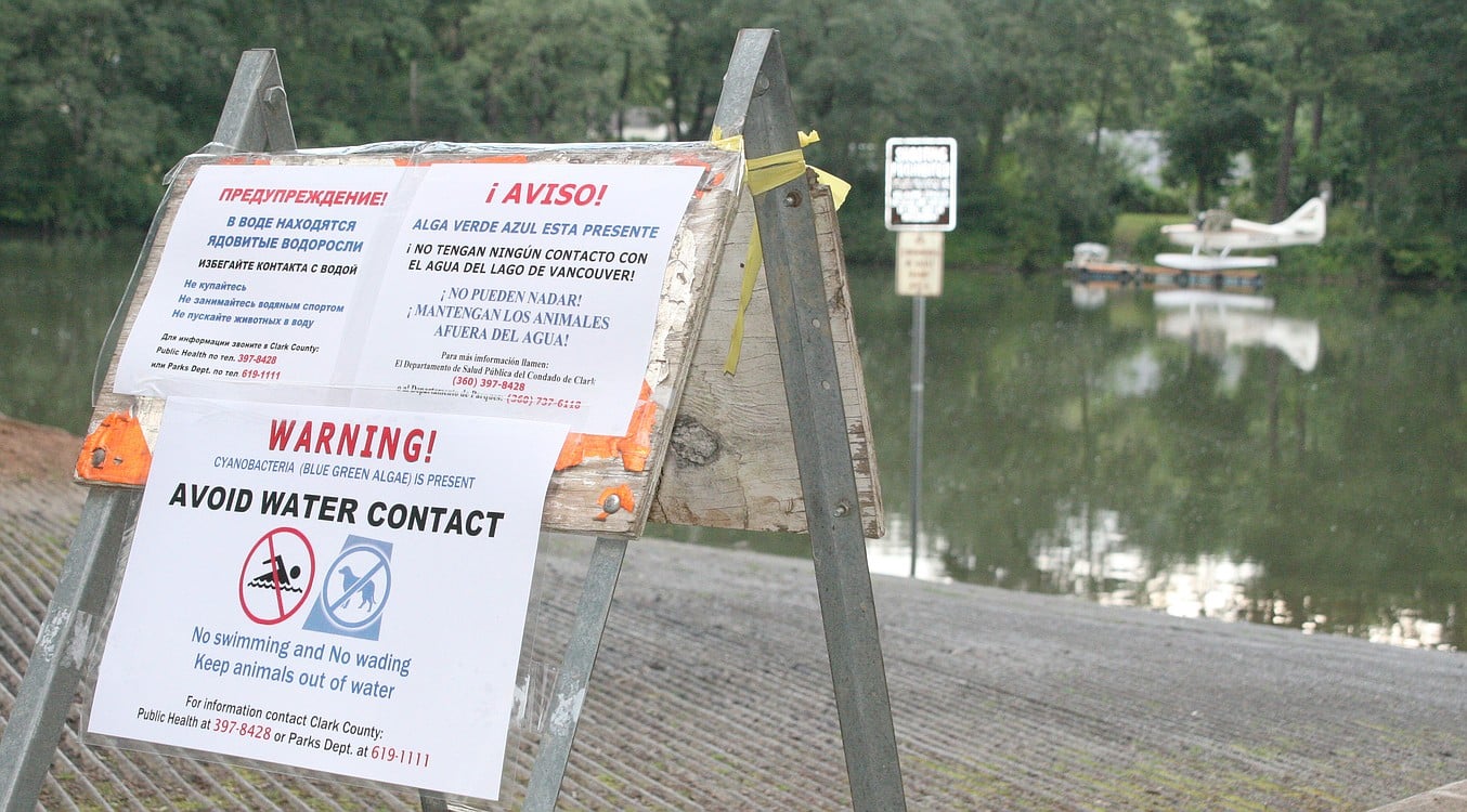 (Post-Record file photo) Signs posted at various entry points near Lacamas and Round lakes in Camas warn people to avoid contact with the water due to a possible bloom of toxic blue-green algae, which can harm animals and humans, in 2015. The county today issued advisories warning of another potential outbreak in both lakes.