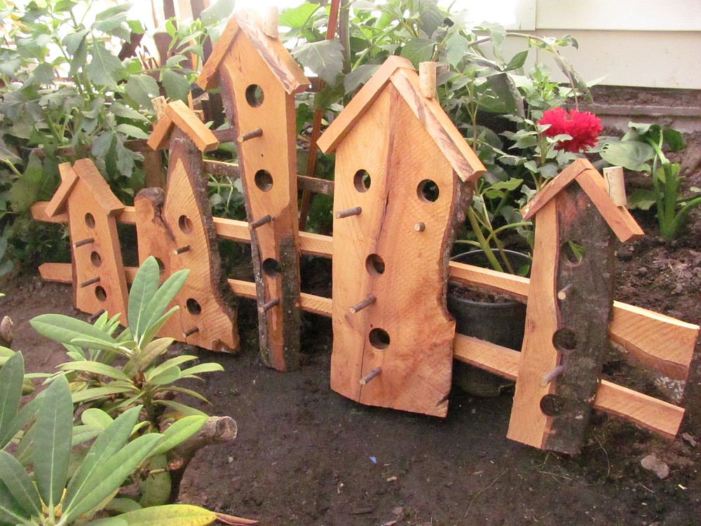 These "faux birdhouses" are among Vern Schanilec's creations using recycled lumber. Some of the wood is found near his residence. Schanilec, 76, is a Master Gardener and author of several books about gardening.