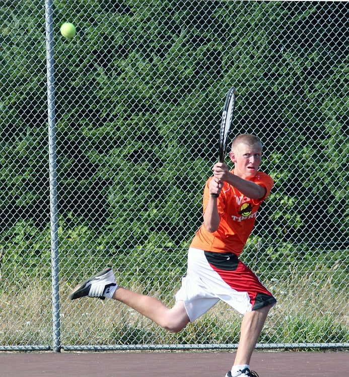 Regan Townsend backhands the ball for Washougal Friday, on the Camas tennis court. The Papermakers defeated the Panthers 5-1.