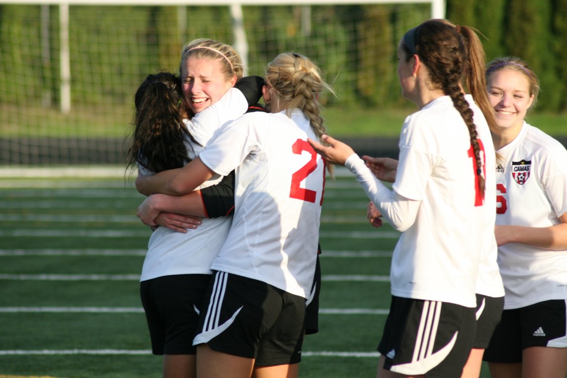 Camas High School goalkeeper Lauren Rood celebrates with her teammates after blocking three kicks by Mead in the shootout Saturday, at Doc Harris Stadium. Courtney Loewen, Emily Ponce and Rachel Gibson hit the back of the net for the Papermakers, who are on their way to the final four their first year in 4A.