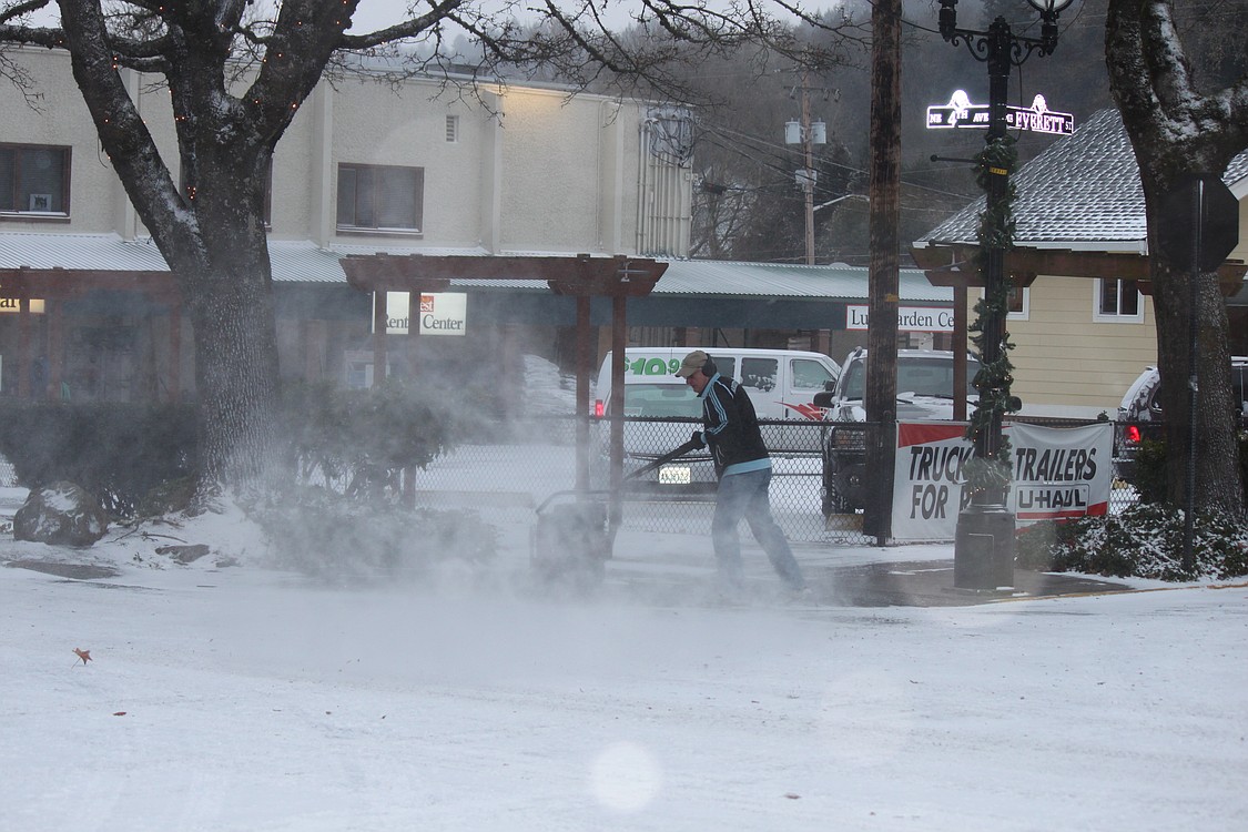 This morning, local merchants worked to clear downtown Camas sidewalks using methods ranging from salt to snow blowers.