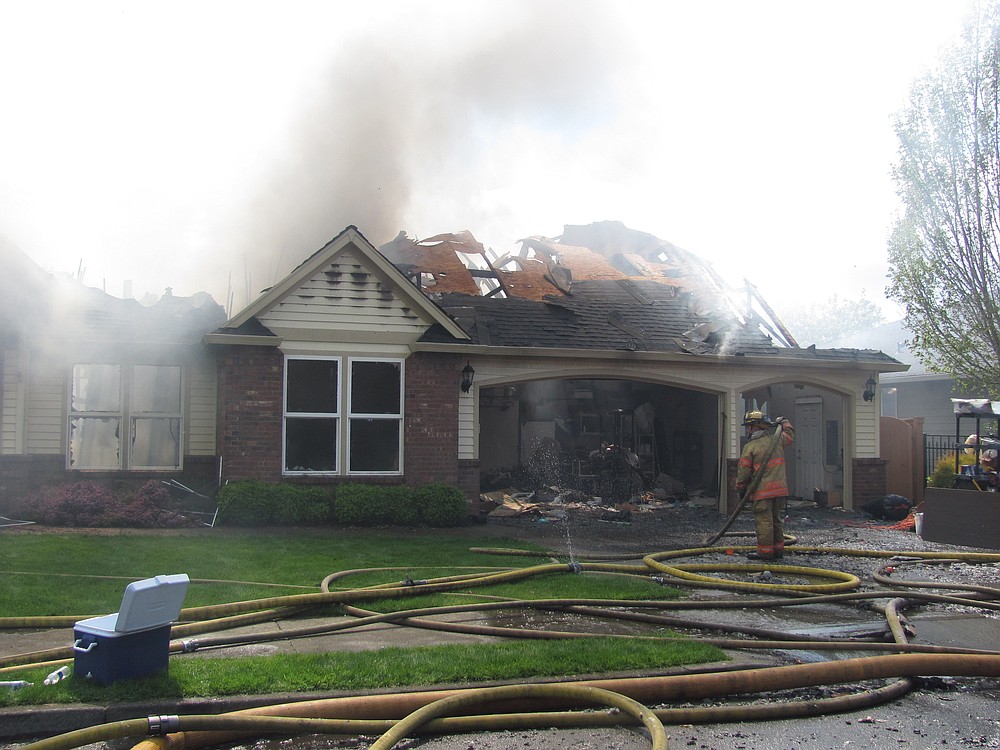 Firefighters from several agencies responded to a structure fire in Camas Tuesday afternoon. Alan Murray, co-owner of the home at 3627 N.W. Sierra Drive, said his son Brian accidentally started the fire on the deck.