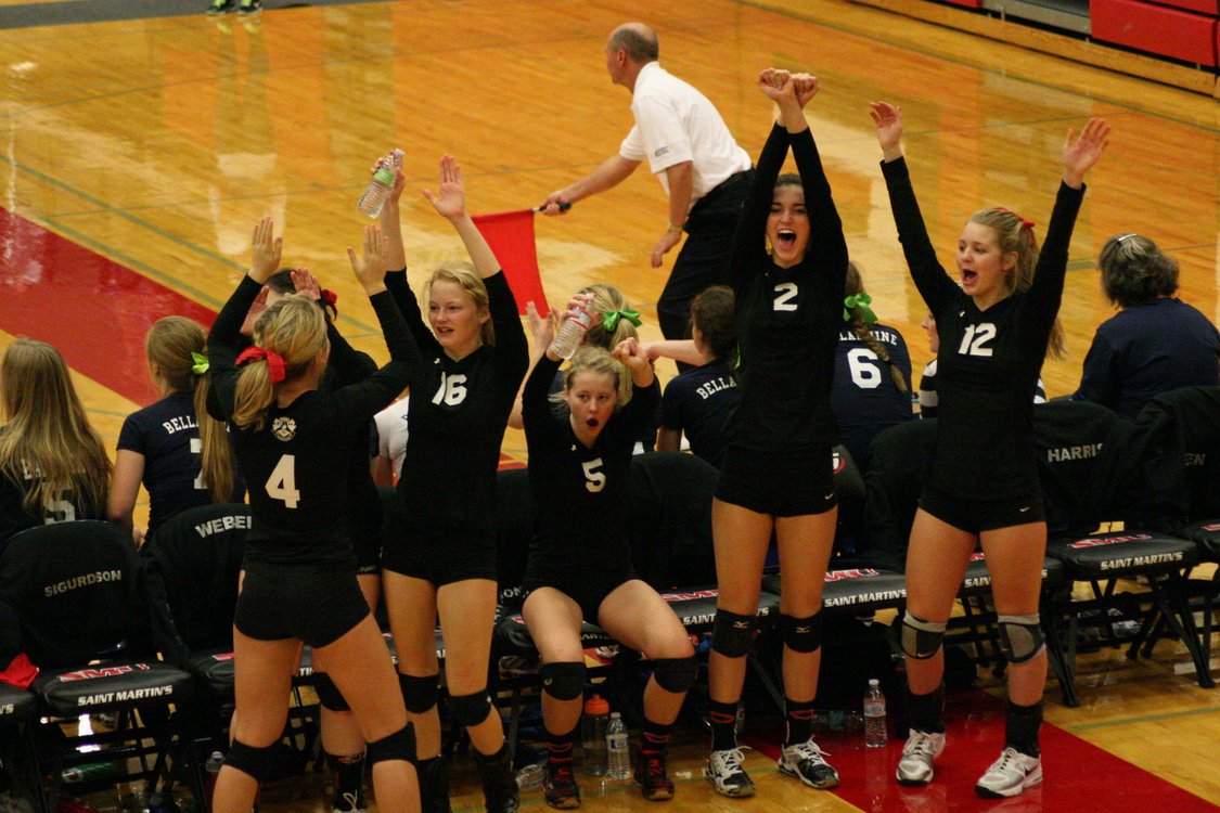 Camas volleyball players celebrate a point for the Papermakers during the state tournament Friday, at St. Martin's University, in Lacey. Camas defeated Mead in the first round, but lost to Emerald Ridge in the quarterfinals.