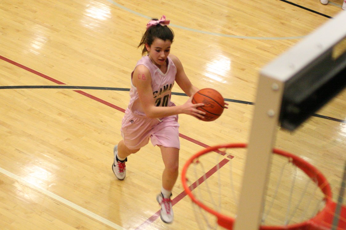 Brenna Vargo finishes off a fast break for the Papermaker girls basketball team Friday, at Camas High School. The Camas girls and boys both beat Heritage on Hoops for Pink night.