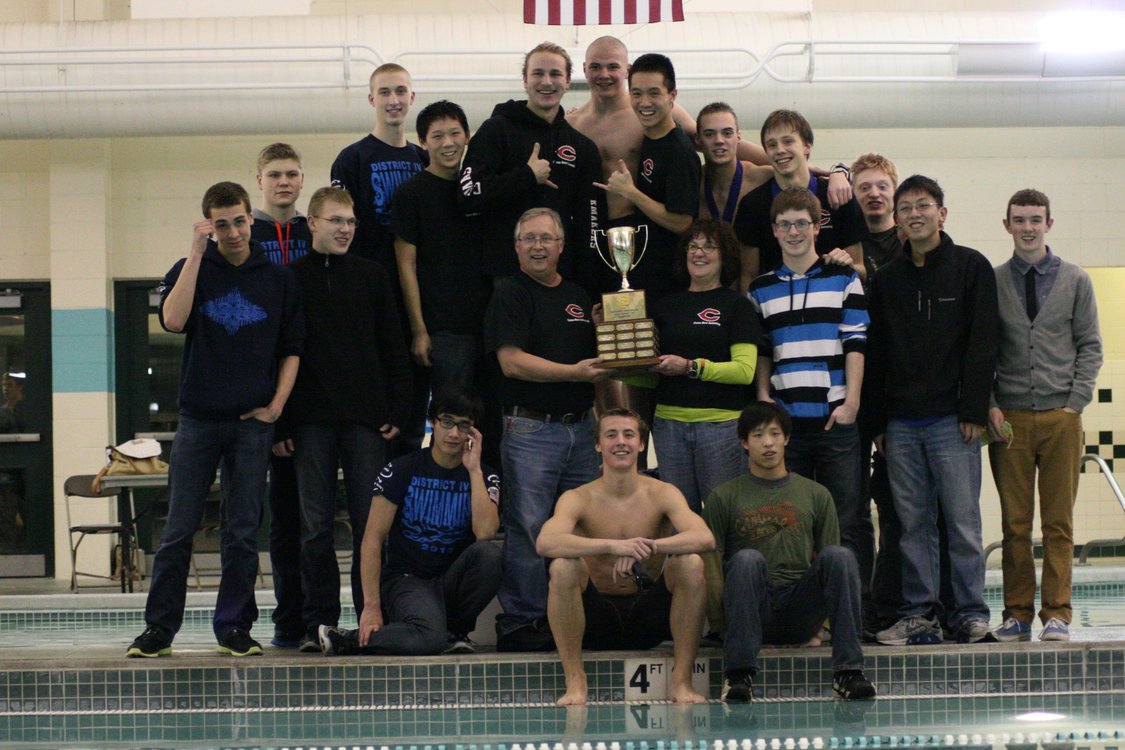 The Camas High School boys swimmers and their coaches celebrate winning the 4A district championship meet Thursday, at Propstra Pool. The Papermakers racked up 459 points. Skyview finished in second place with 323 points.