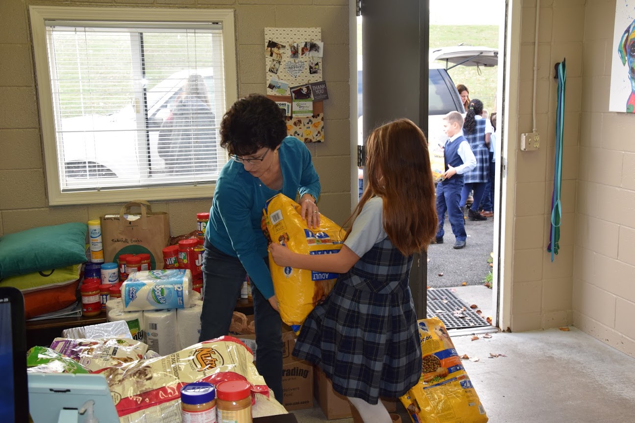The students from Rachel Neuberger’s second grade class helped unload the schools donations into the dog shelter at the WCGHS. Neuberger’s class collected the most donations and won a trip to the humane society.