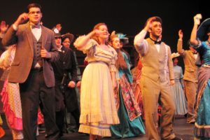 The "Hello, Dolly!" cast sings "Put on Your Sunday Clothes," before an outing in New York City.  The musical is based on Thornton Wilder's, "The Matchmaker," and  features a colorful cast.