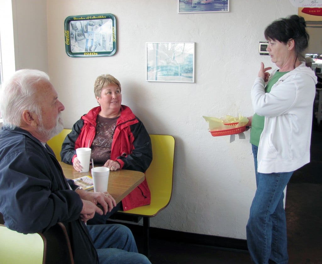 Marlene Macrae-Smith, co-owner of the Old Fashion Maid Restaurant, chats with customers in the dining area. She and her husband John (not pictured) have owned the Camas eatery for a total of 27 years. They plan to close the restaurant this month, retire and move back to Everett, to live near family members.