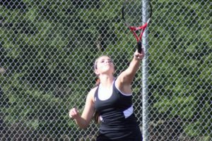 Sydney Schwartz strikes a tennis ball on a rare sunny Friday, in Camas. The Papermakers defeated Prairie 4-2.