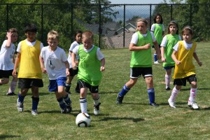 Kids kick the ball around Friday, during the final day of the Dan Macaya Soccer Camp at the Prune Hill Sports Park in Camas.