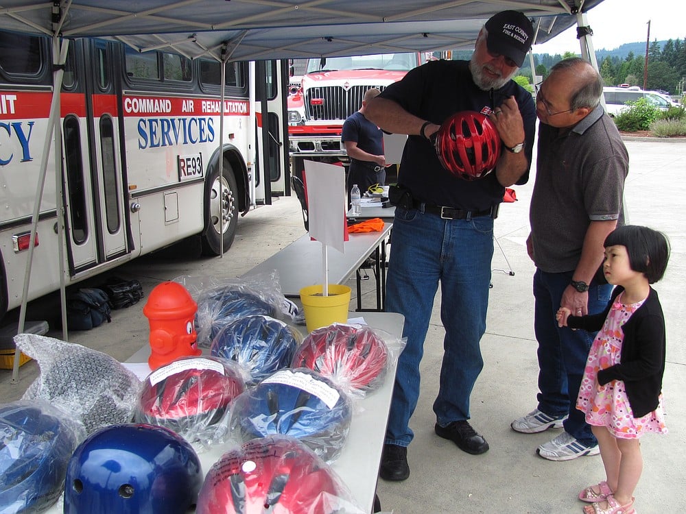 Bike and sports helmets were available to purchase Sunday at the East County Fire and Rescue open house. The event, held at the Fern Prairie station, also included blood pressure checks and a bouncy house, as well as opportunities to try on child-sized firefighter turnouts, put out a simulated house fire and climb aboard a Life Flight helicopter.