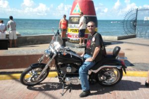 Greg Laird poses in Key West, Fla., the starting point to the Hoka Key Challenge.  The 9,000 mile race, in extreme conditions, took 12 days for him to complete.