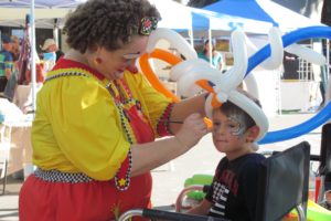 Camas LIVE! brought people downtown to enjoy the range of activities for all ages Friday and Saturday. Here, a young visitor gets his face painted by Bizzy the Clown.
