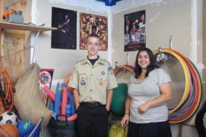 Brandon Hanks, 15, built shelves, and painted and organized the storage area at the Jack, Will and Rob Boys & Girls Club for his Eagle Scout project. At right is program director Mandy Cervantes.