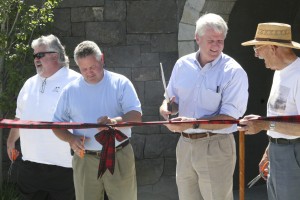 On Saturday morning, local officials including (left to right) former Washougal Mayor Jeff Guard, current Washougal Mayor Sean Guard, Third District Congressman Brian Baird, former Washougal Mayor Les Sonneson, and current Pendleton Manager Charlie Bishop (not pictured) performed the Washougal Pedestrian Tunnel's ceremonial grand opening using a ribbon made from Pendleton wool. The event was attended by a variety of local, state and federal officials and representatives. The tunnel entrance is located at 2 Pendleton Way, in downtown Washougal.