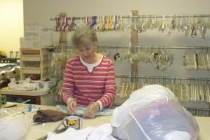 Volunteer Barbara Gray sorts clothing donated to the Inter-Faith Treasure House in Washougal.  The Vancouver resident has given her time to the local organization, which will celebrate its 40th anniversary on Saturday, for the past 12 years.