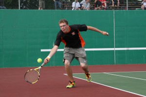 Eyan Cagle flicks the tennis ball over the net for the Panthers. Cagle and Patrick McCarthy defeated their opponets from Camas in straight sets Friday, on the Washougal High School tennis courts.