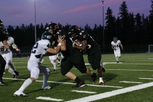 Daniel Anderson clears the road for Zack Marshall Friday, at Doc Harris Stadium. Camas defeated Skyview 28-12.