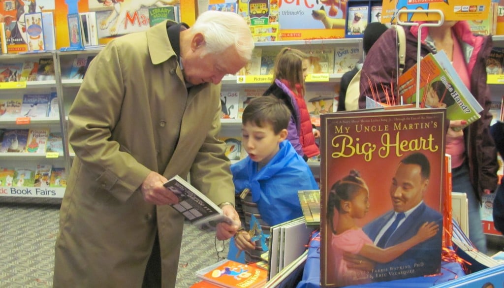 Sean Emberlin, 7, and his grandfather Bill Emberlin browse the selection at the Prune Hill Elementary School Scholastic book fair on Monday morning. The event is being held this week in conjunction with Superhero Costume Day and Grandparent Breakfast. In an effort to get everyone into the spirit of the event, masks and capes were available for students at the library. Other events this week will include story times with special guest readers and a live reptile show.