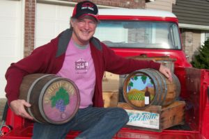 Rusty Wales of Camas has enjoyed wine making for several years. Here, he poses in what he has coined the  "wine wagon," a cherry red 1955 Chevy pick-up truck.