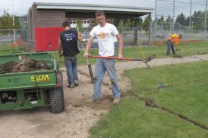 Crew members from Bernhardt Golf dig trenches to add pipes underneath the Camas High School      varsity baseball field for better drainage. The other three CHS ballfields will receive the same treatment.