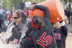 Meadow McWhorter is dunked with Gatorade after the Mt. Hood Community College softball team won another NWAACC title on May 24.