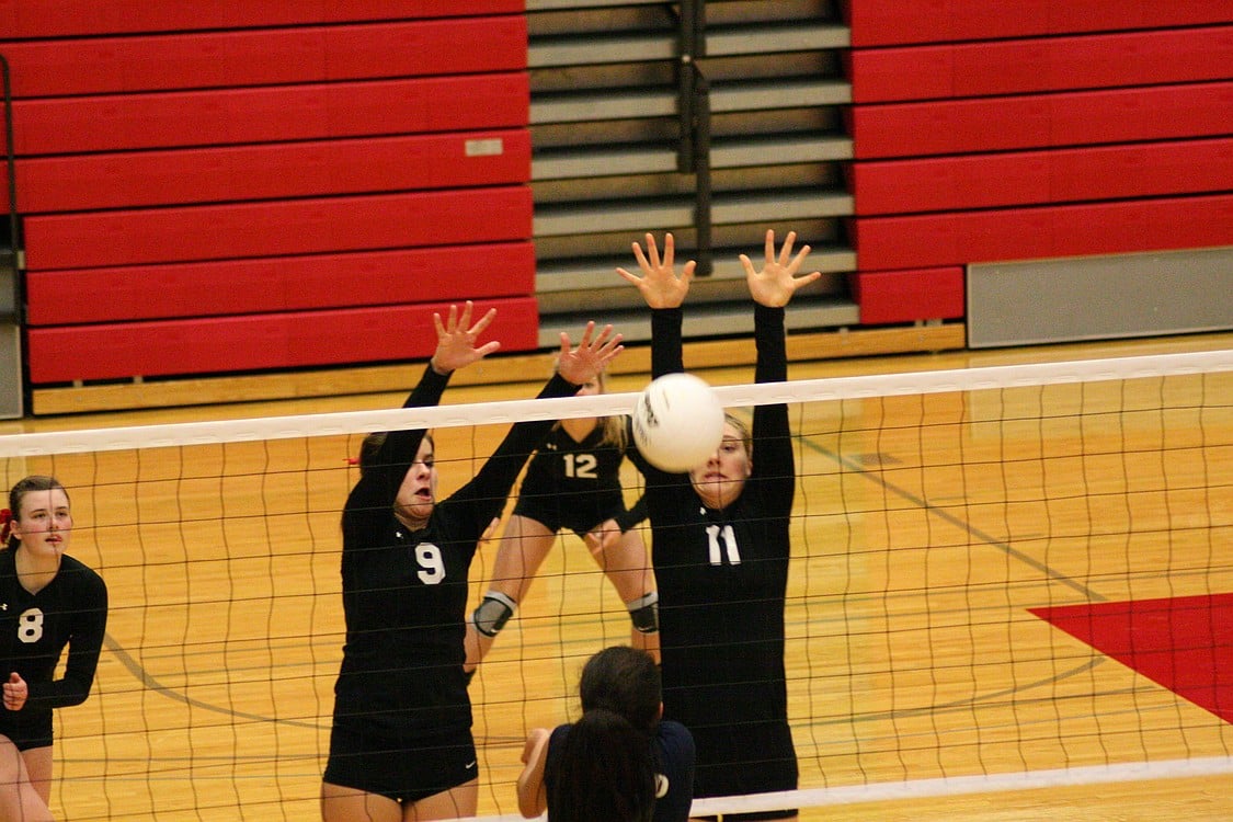 Lauren Harris and Carly Banks double up at the net.