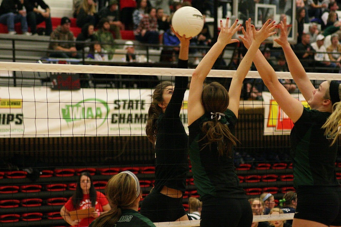 Sophi Jacobson battles at the net.