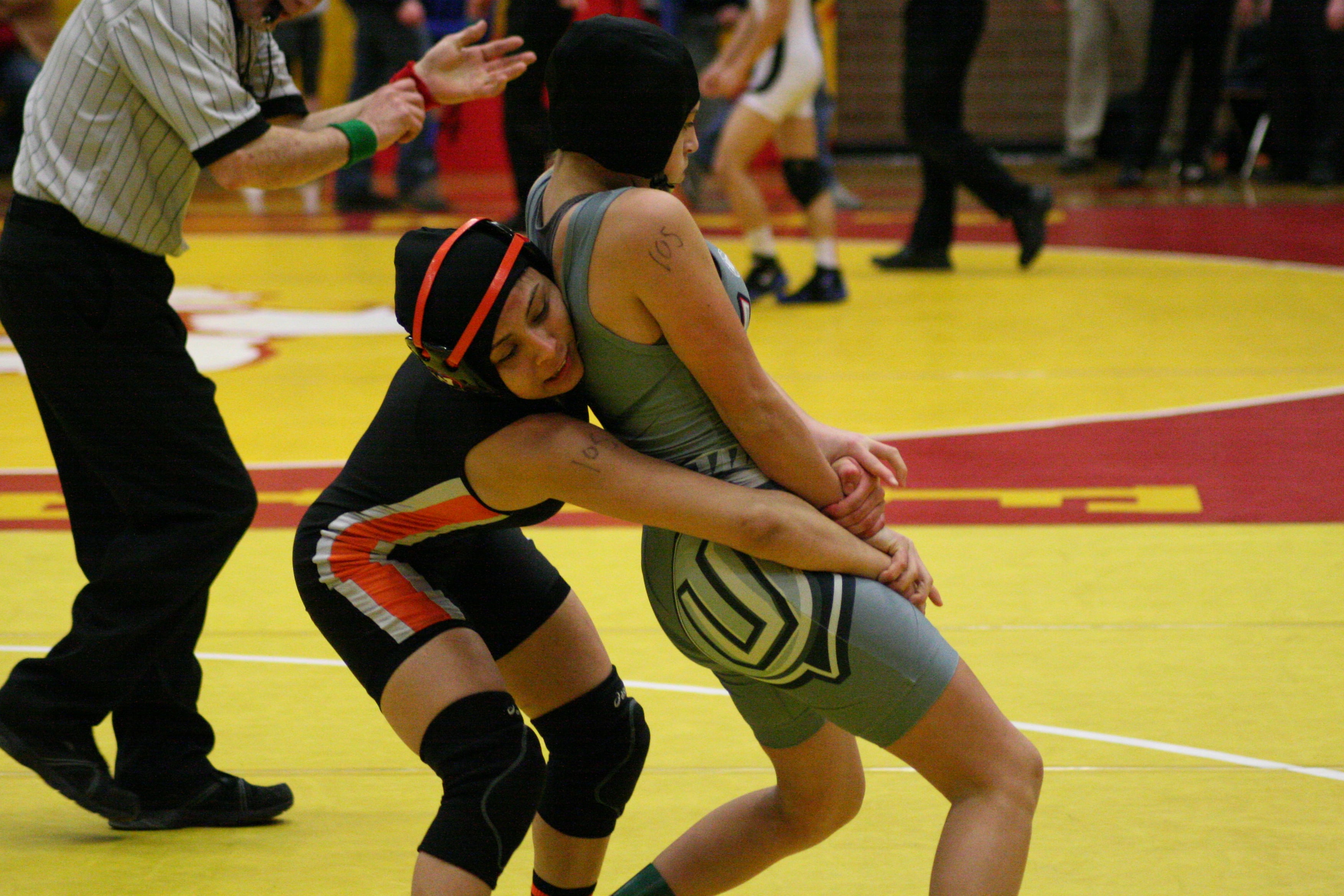 Washougal High School junior Yaneli Martinez wrestles a Union Titan for the 105-pound Clark County championship medal.