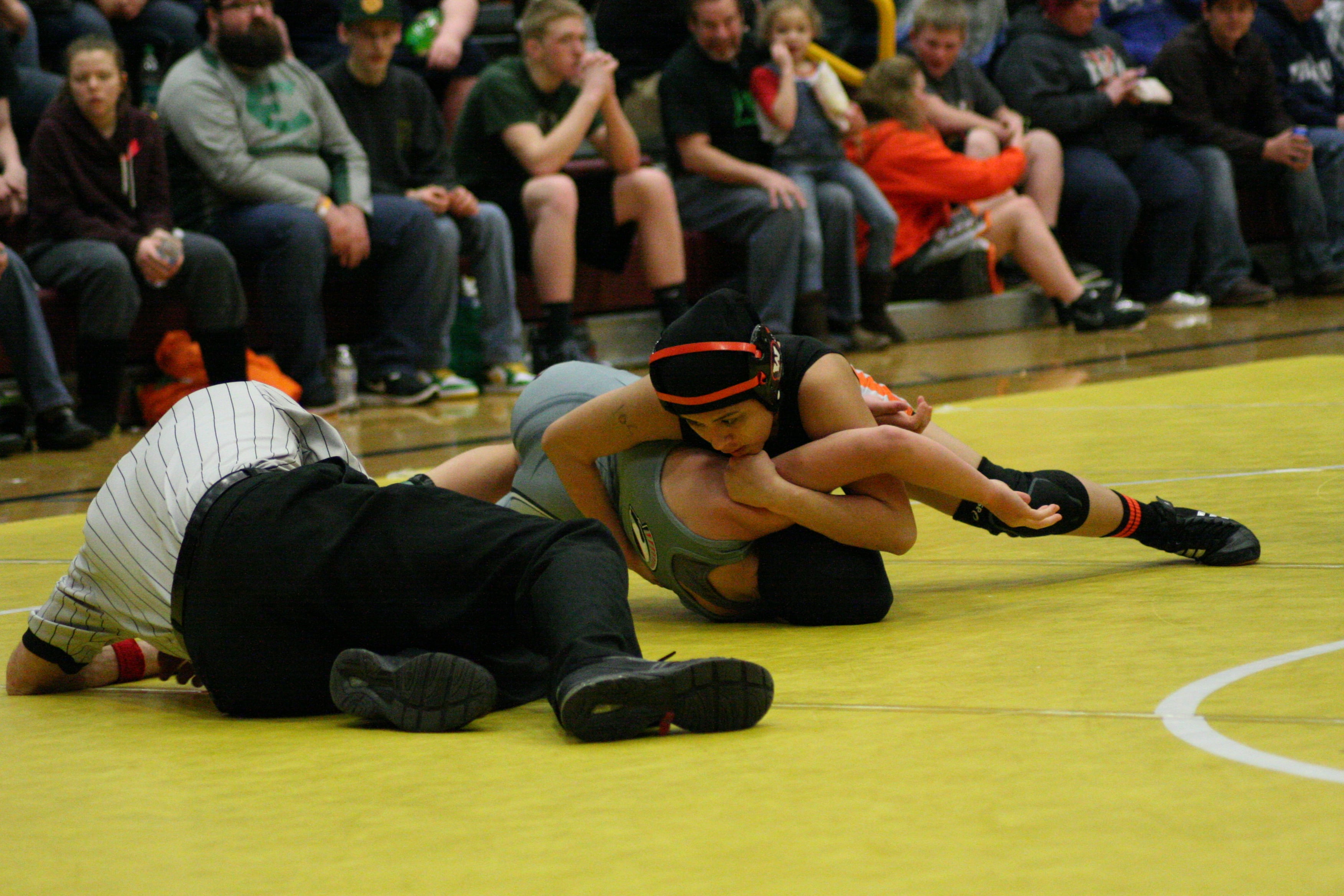 Yaneli Martinez pins her opponent for the 105-pound county title.