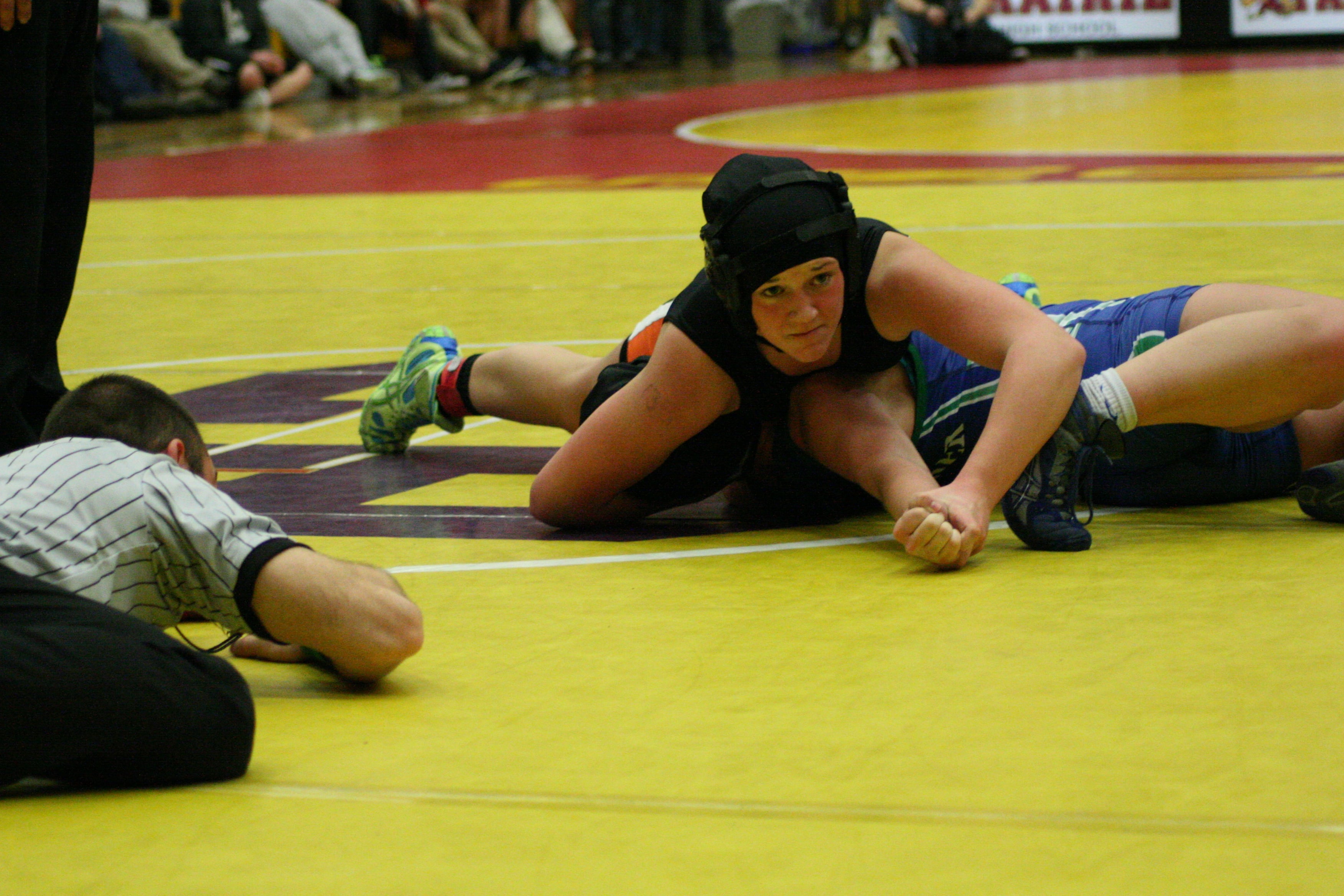 Morgan Ratcliff pins her opponent for the 135-pound county title.