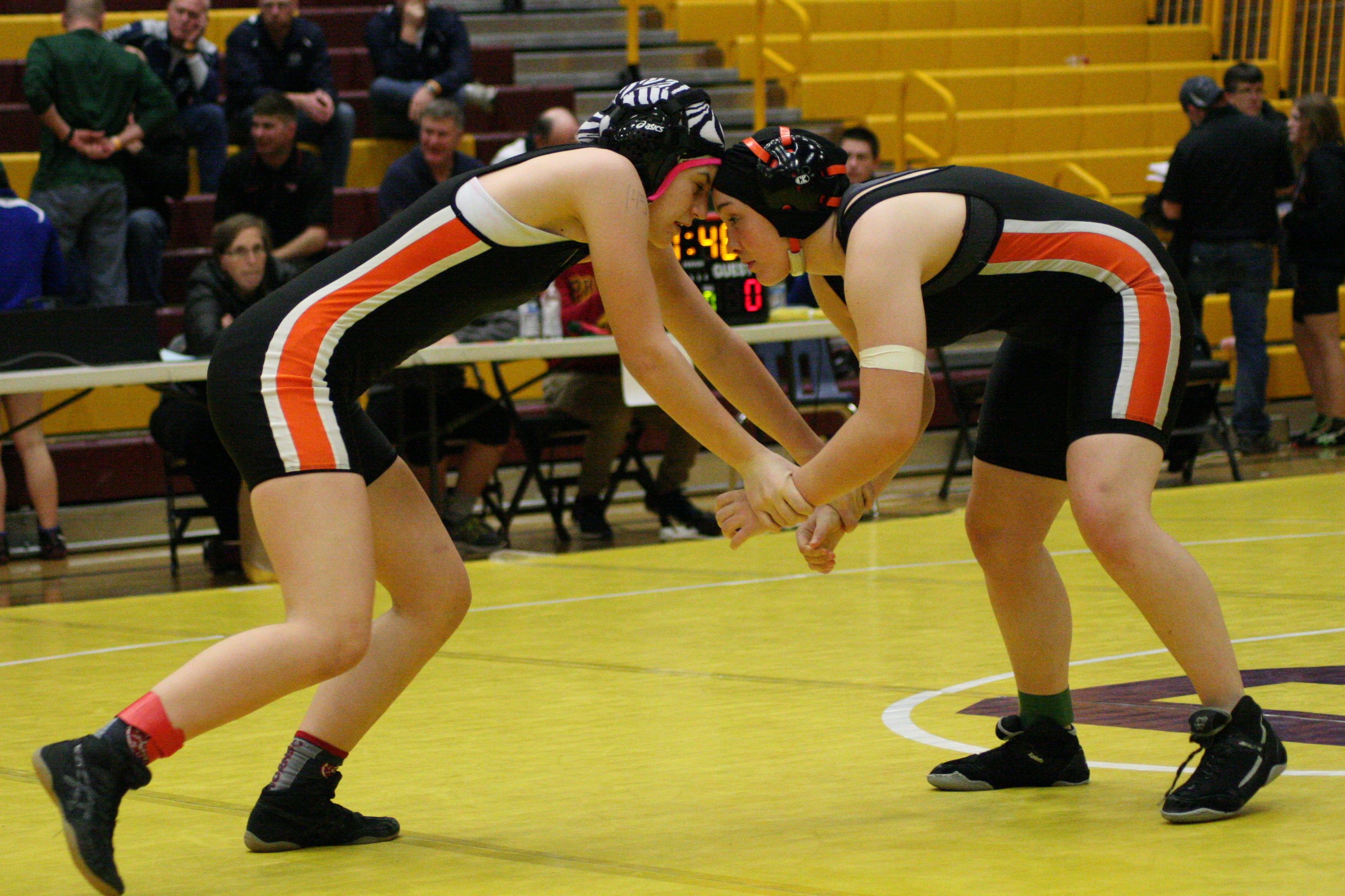 Hannah Eakins (left) and Christina Murray (right) butt heads for Washougal in the 145-pound county title match.