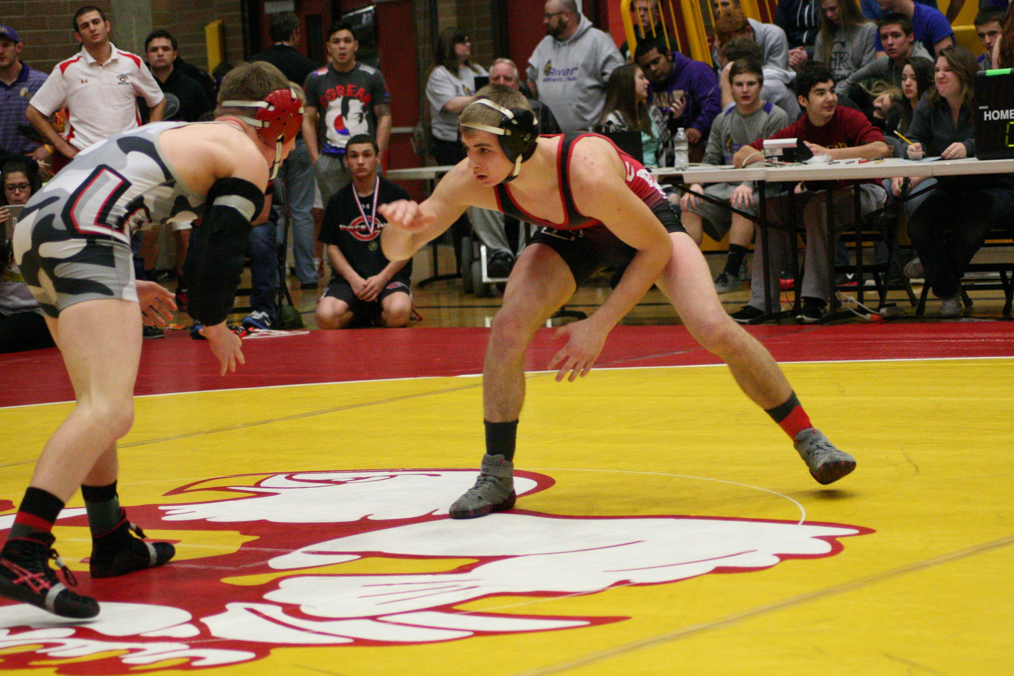 Camas High School senior Bryant Elliott sizes up Tommy Strassenberg, of Union, in the 145-pound Clark County boys championship match.