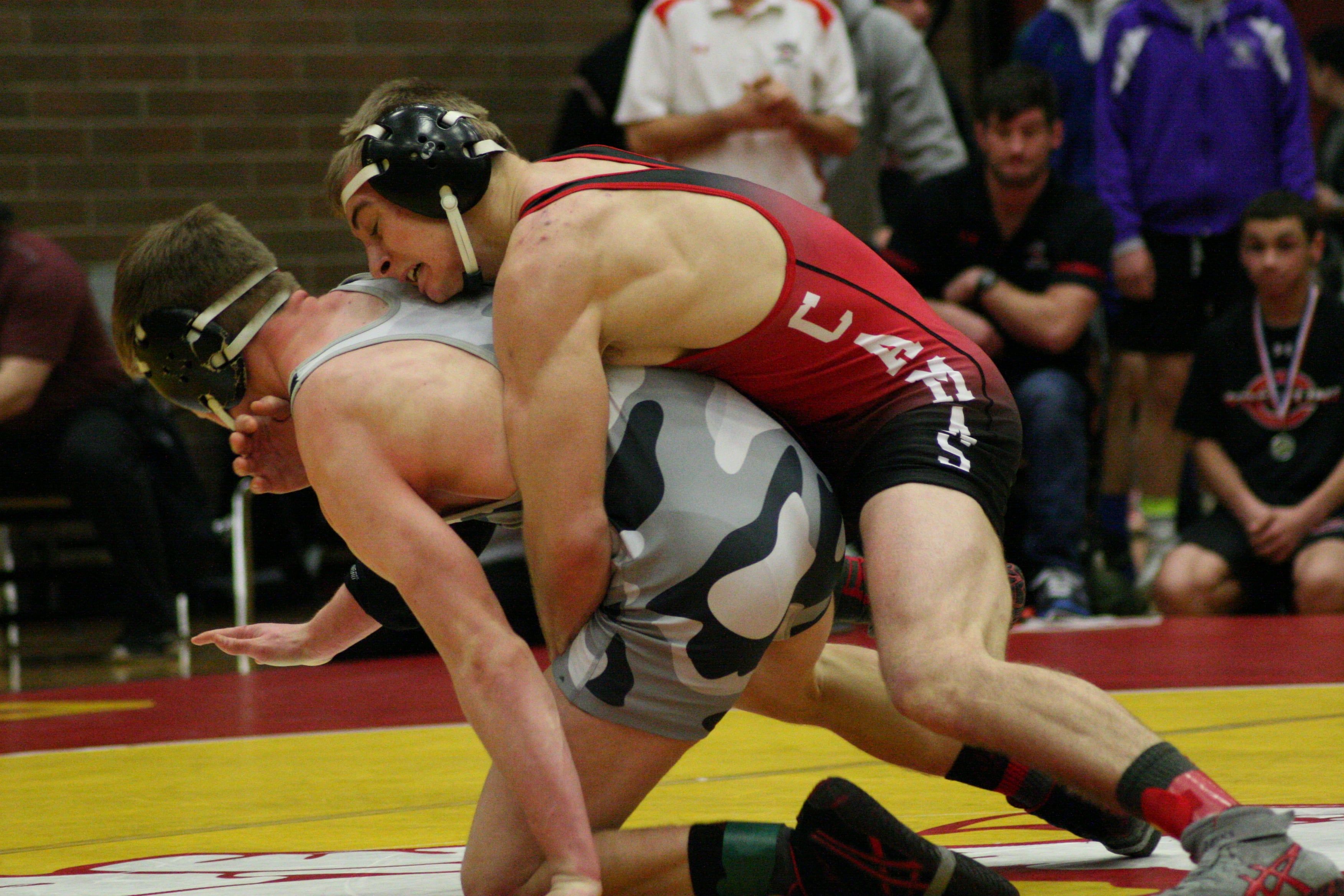 Bryant Elliott hangs on tight as Tommy Strassenberg tries to escape.