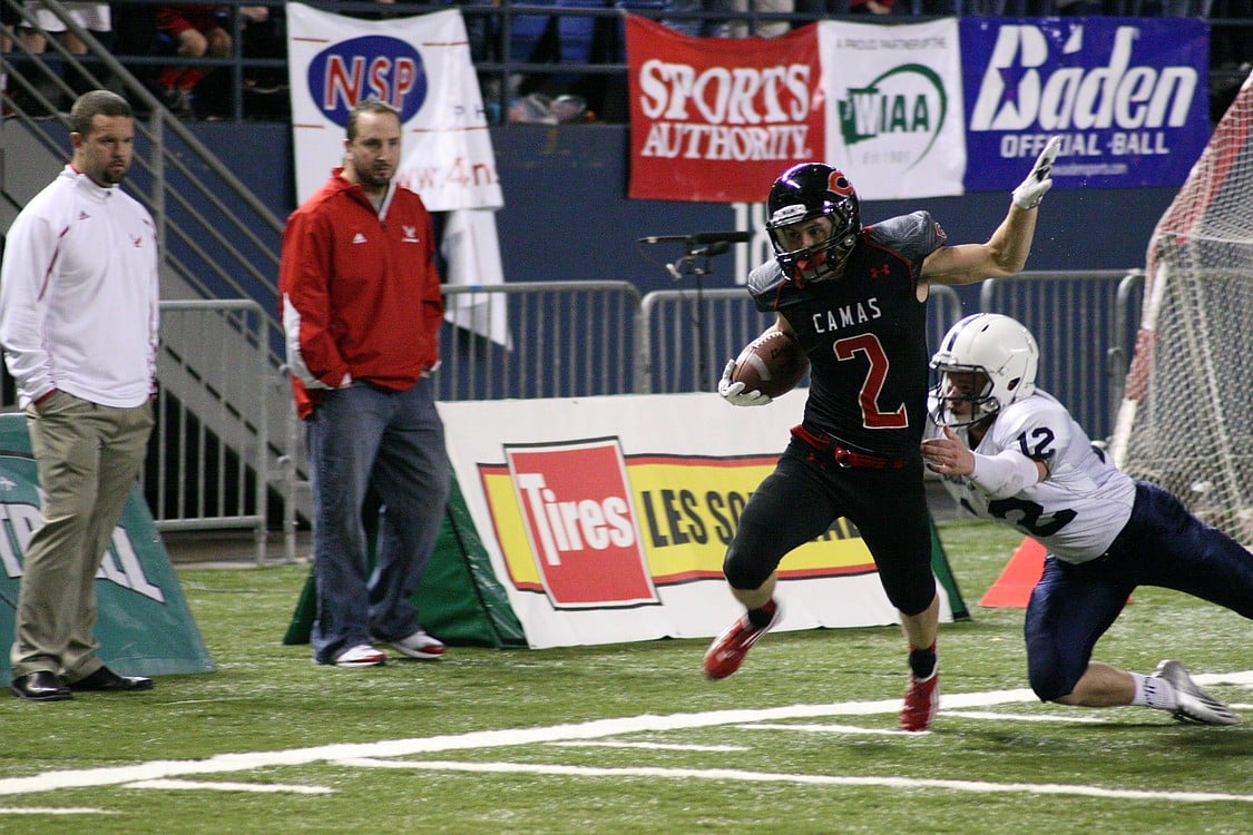 Zach Eagle shakes off a Bellarmine Prep defender and targets the end zone for his third touchdown of the game.