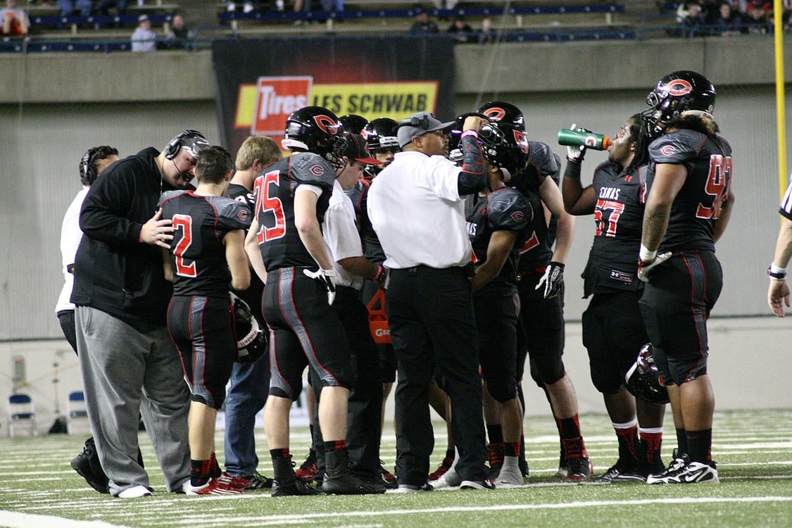 Defensive huddle for the Papermakers.