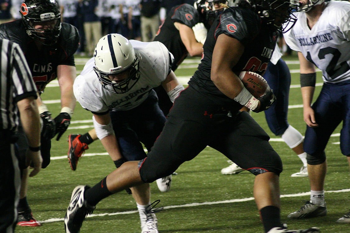 Jason Vailea delivers another touchdown at the goal line for the Papermakers.