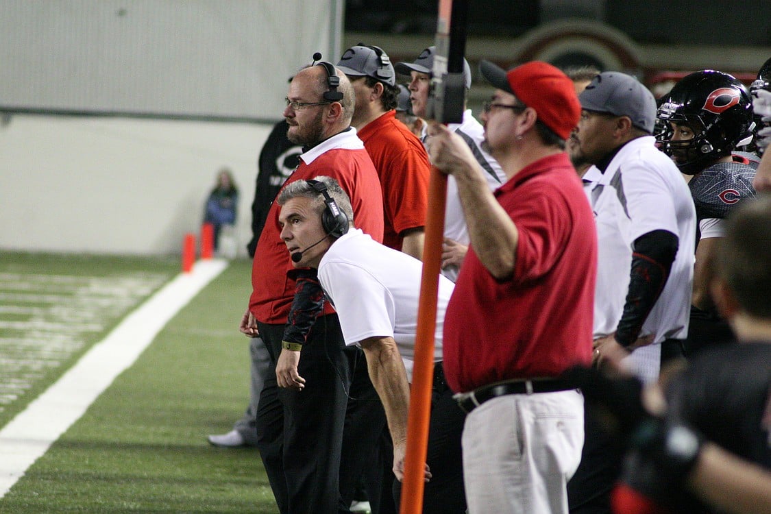 Head coach Jon Eagle in the ready position as the Papermakers attempt to make a stand on fourth down.