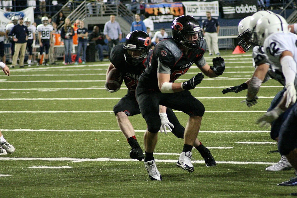 Cole Zarcone gets a block from Matt Danis.