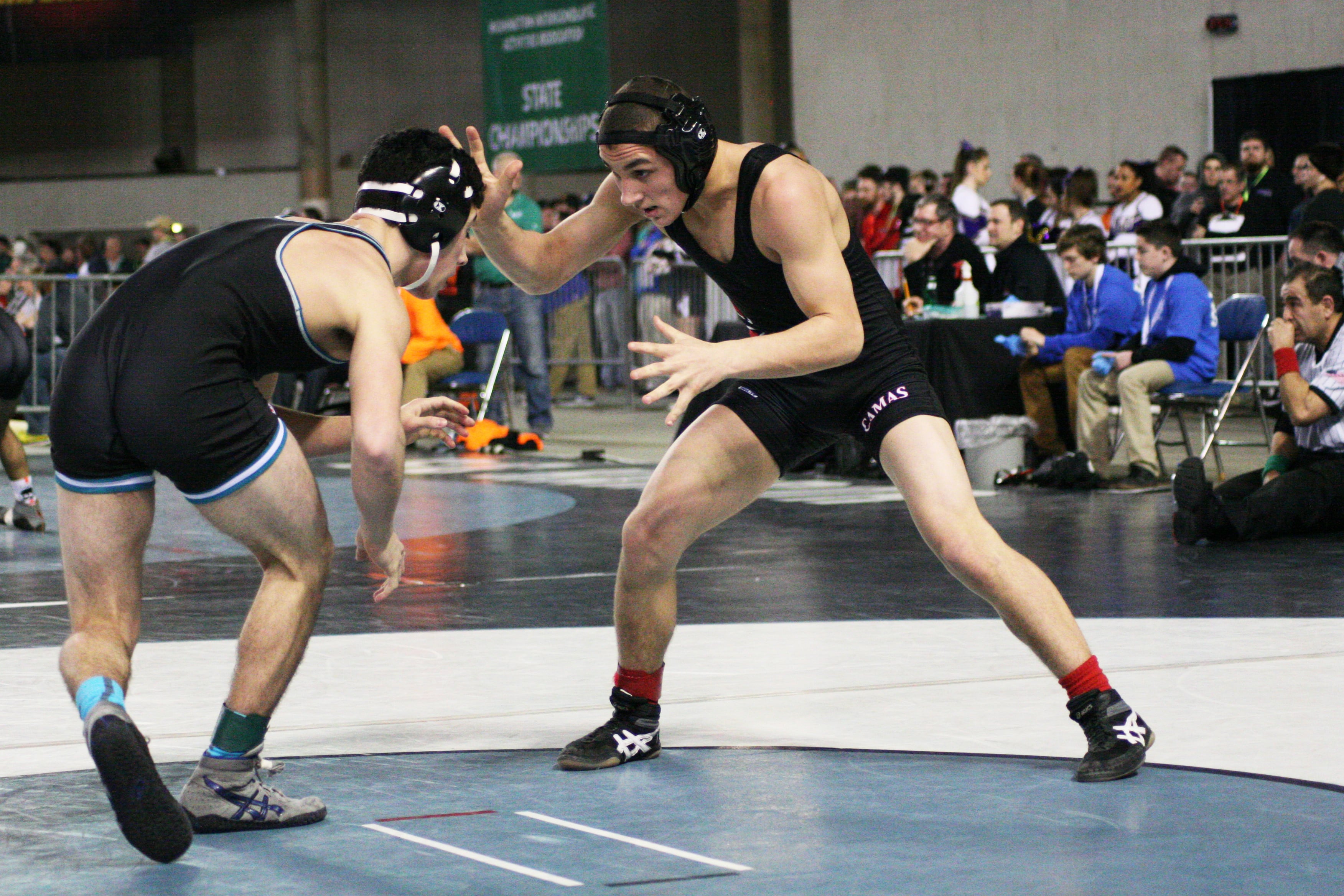 Camas freshman Rylan Thompson sizes up a senior in his first high school state tournament match.