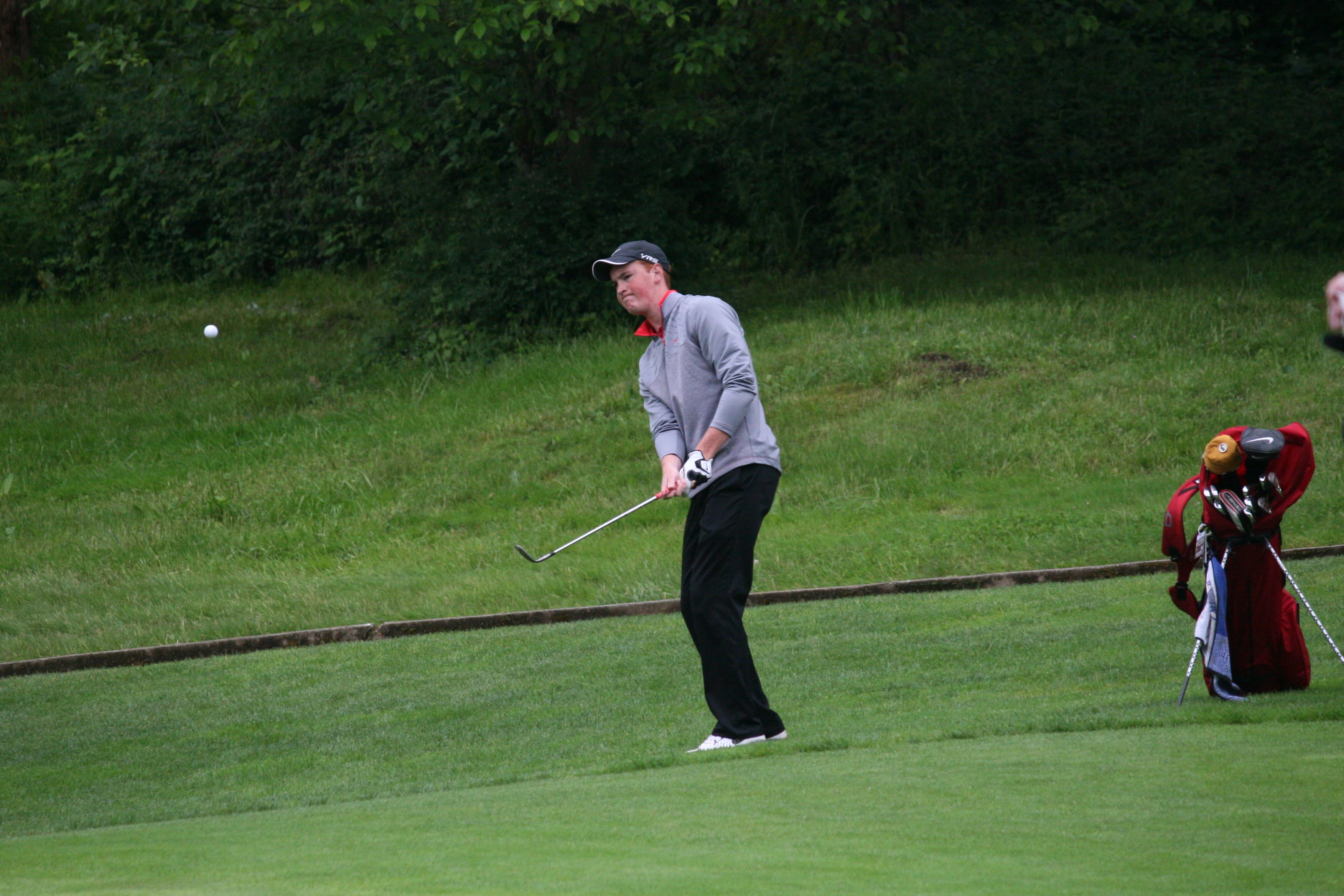 Brian Humphreys chips on to the ninth green during the final round of the state tournament, at Camas Meadows. The CHS sophomore shot 3-under par Thursday to finish in second place.