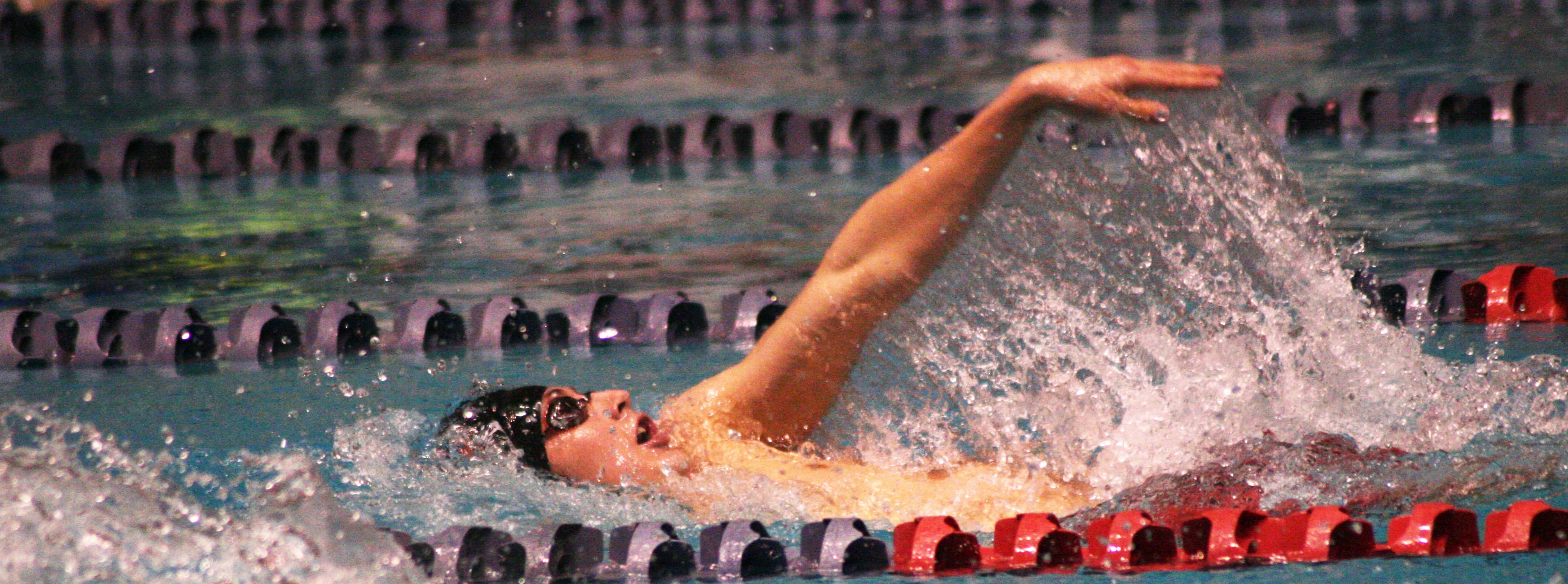 Lucas Ulmer finishes off his 100 backstroke preliminary race.