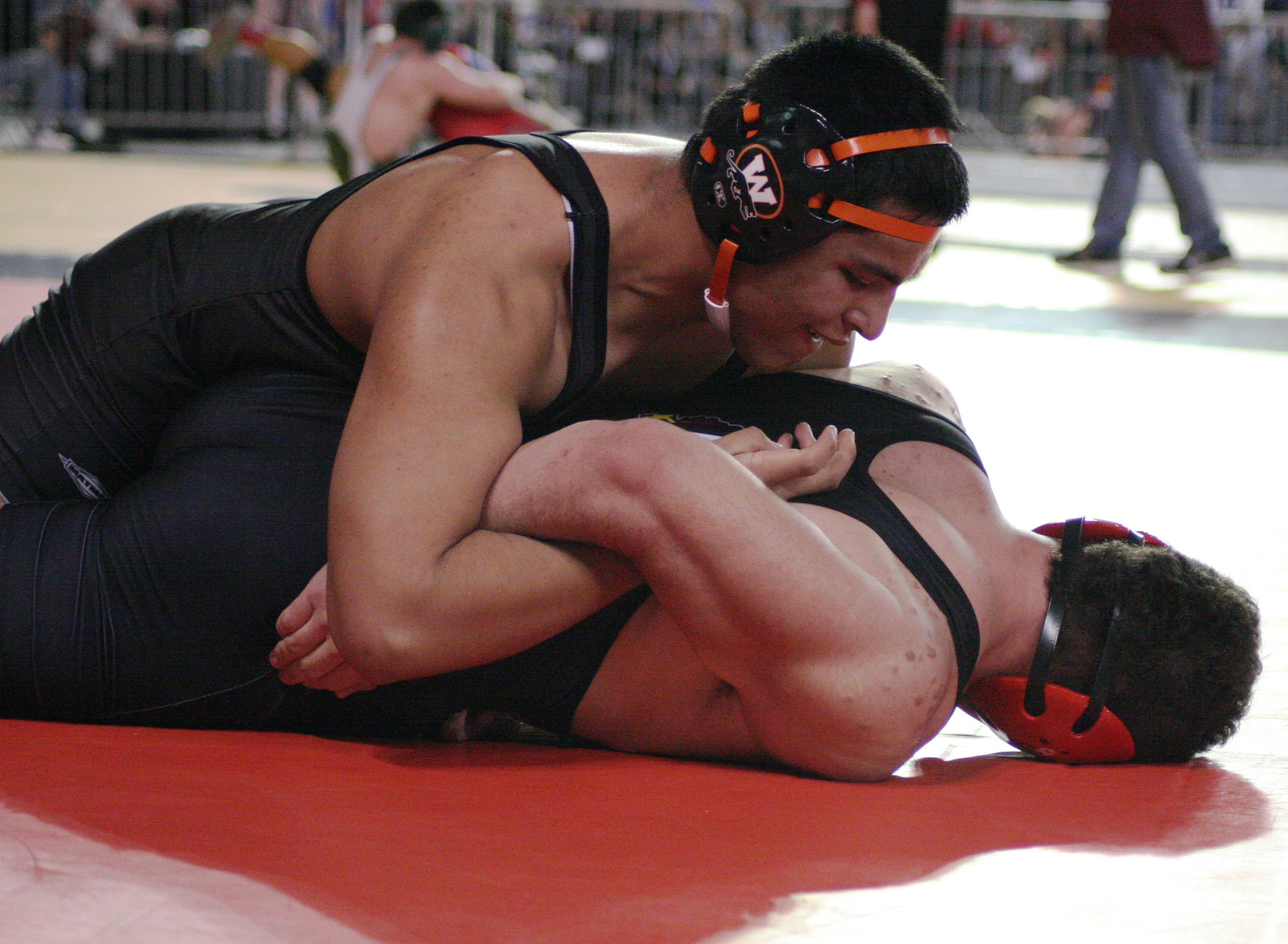 Ruben Aguilar traps his opponent in an arm lock.