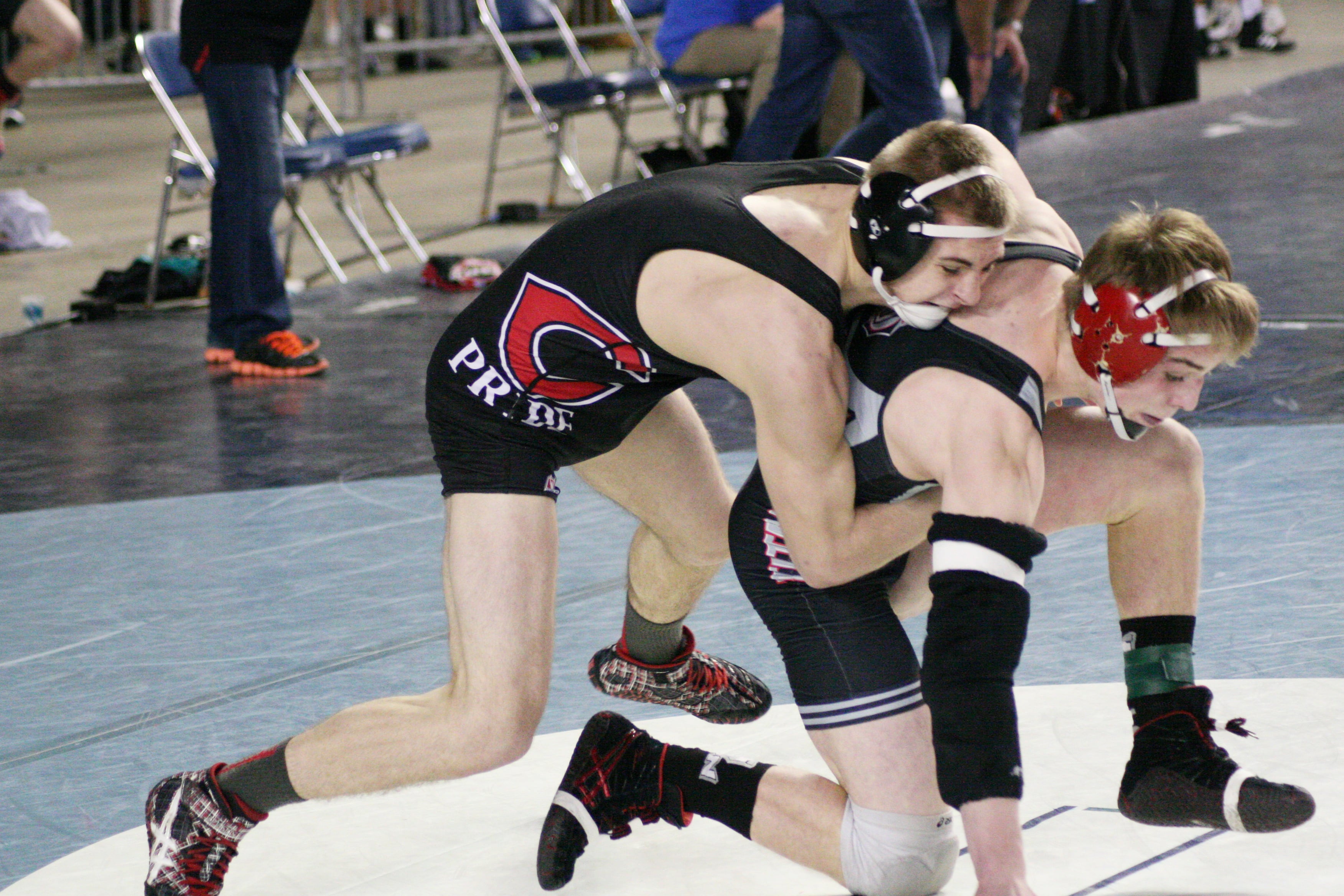 Rivals Bryant Elliott (Camas) and Tommy Strassenberg (Union) wrestle into double overtime.